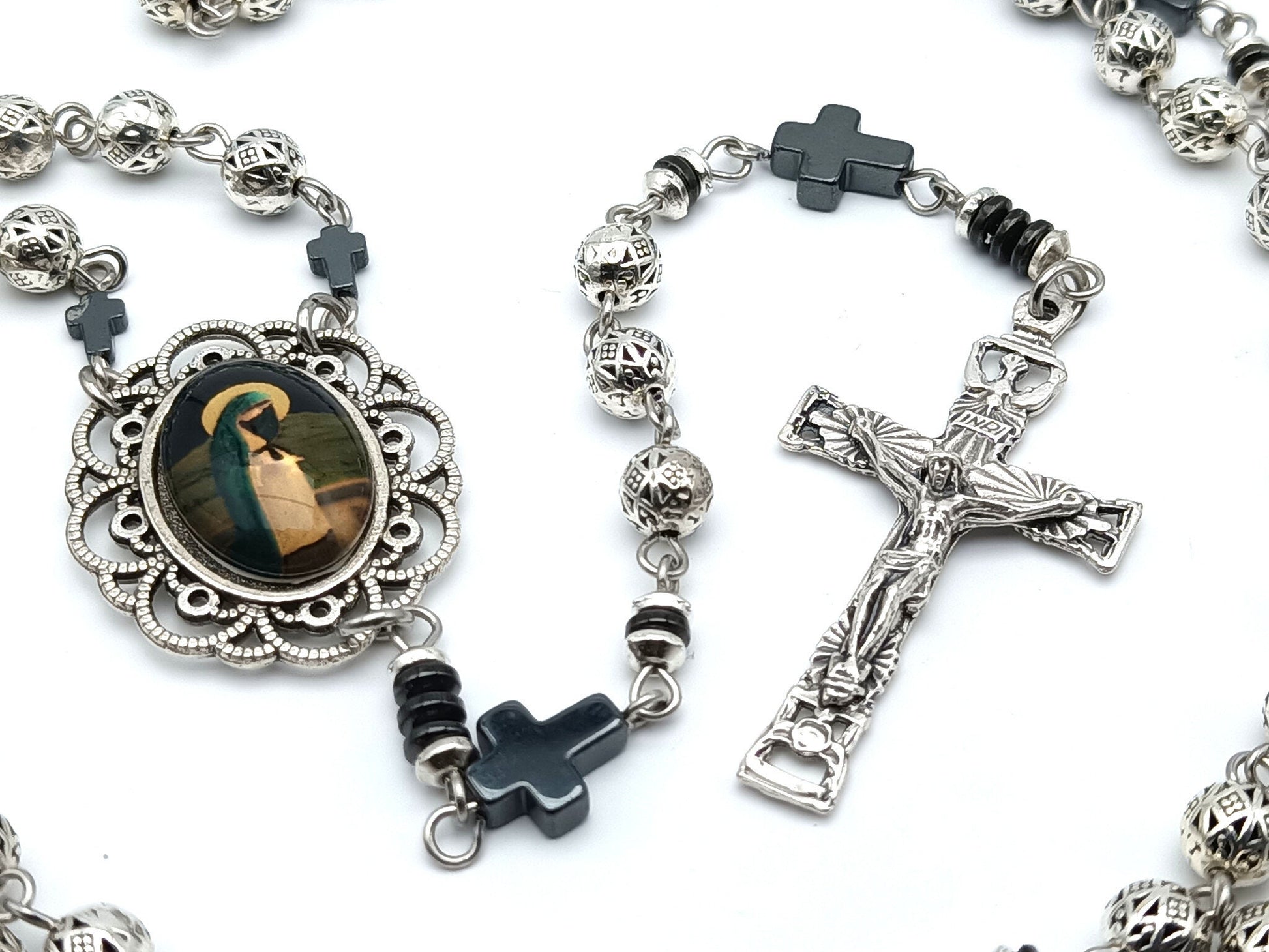 Blessed Virgin Mary unique rosary beads in Tibetan silver with hematite pater beads, silver crucifix and centre picture medal.