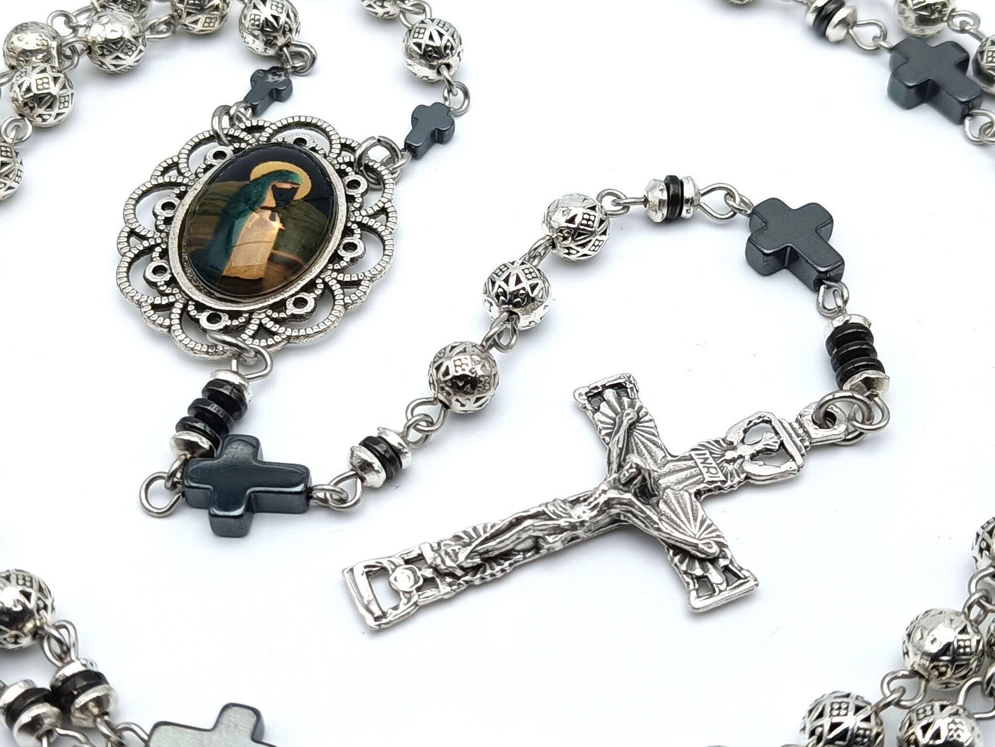 Blessed Virgin Mary unique rosary beads in Tibetan silver with hematite pater beads, silver crucifix and centre picture medal.