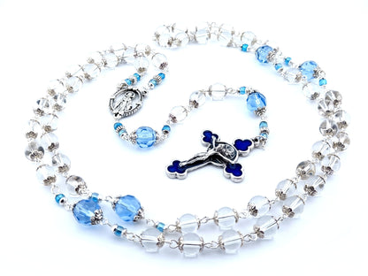 Our Lady of Grace unique rosary beads with clear glass beads, faceted blue glass pater beads, blue enamel crucifix and silver centre medal.
