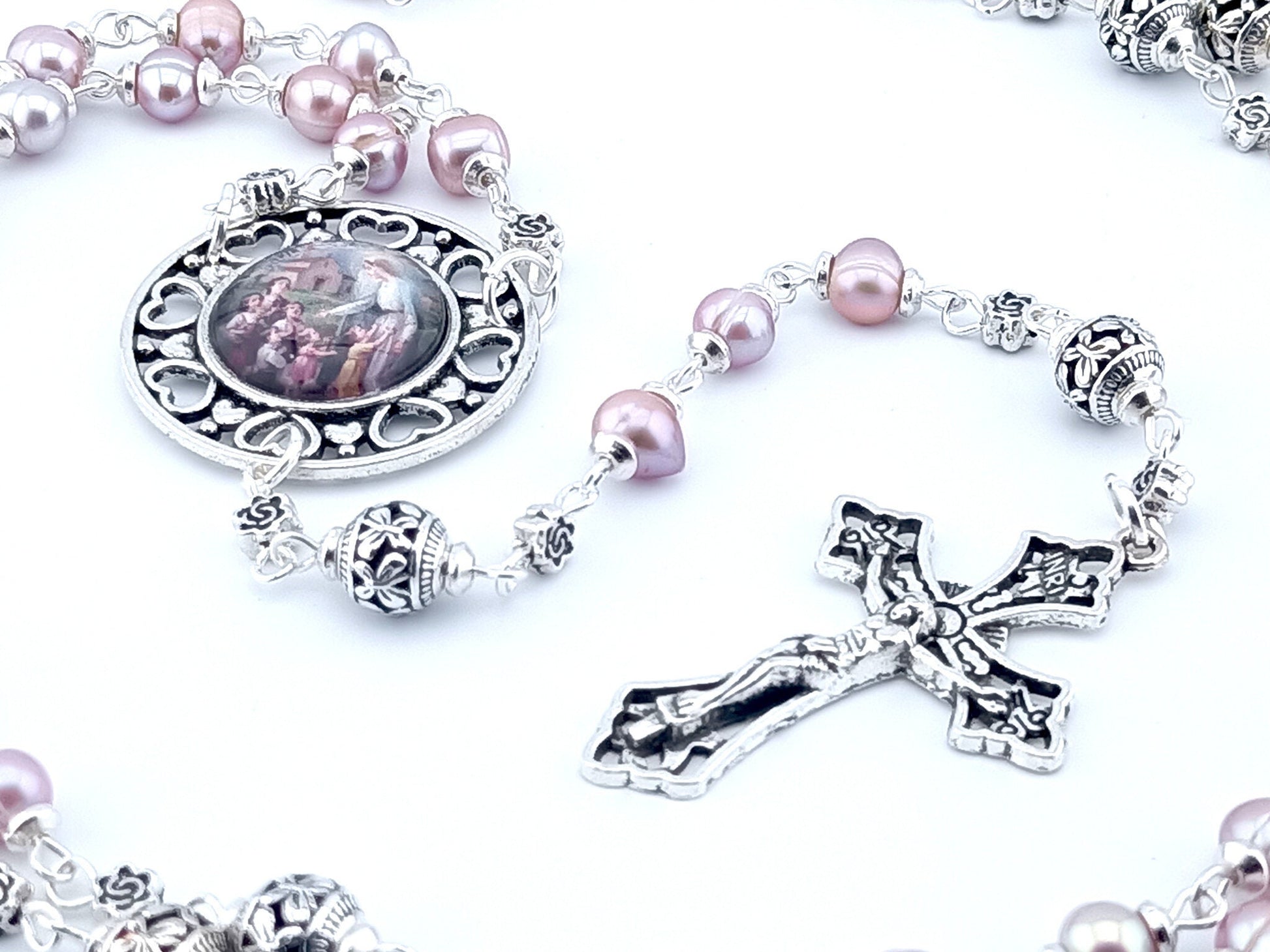Virgin Mary and children unique rosary beads with pink fresh water pearl beads, silver pater beads, crucifix and picture centre medal.