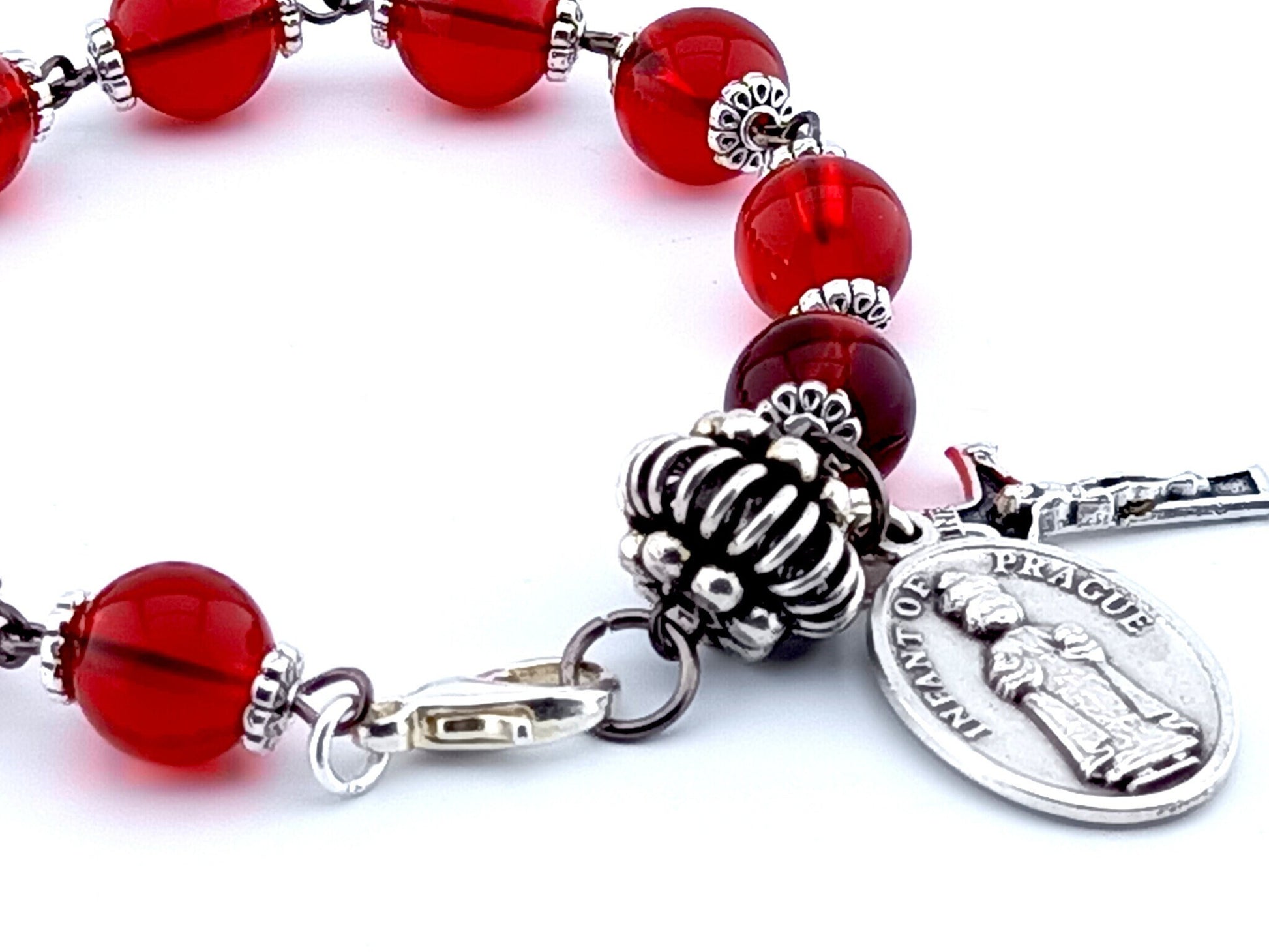 Infant of Prague unique rosary beads single decade bracelet with red glass beads, silver pater bead, crucifix and medal.