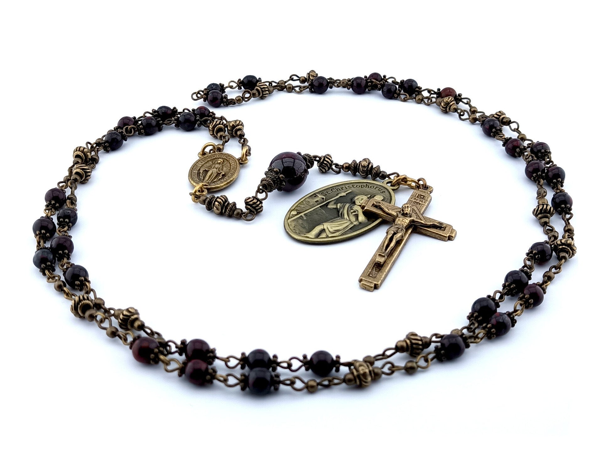 Saint Anthony unique rosary beads prayer chaplet with dark red gemstone beads, bronze crucifix, centre miraculous medal and Saint Christopher medal.