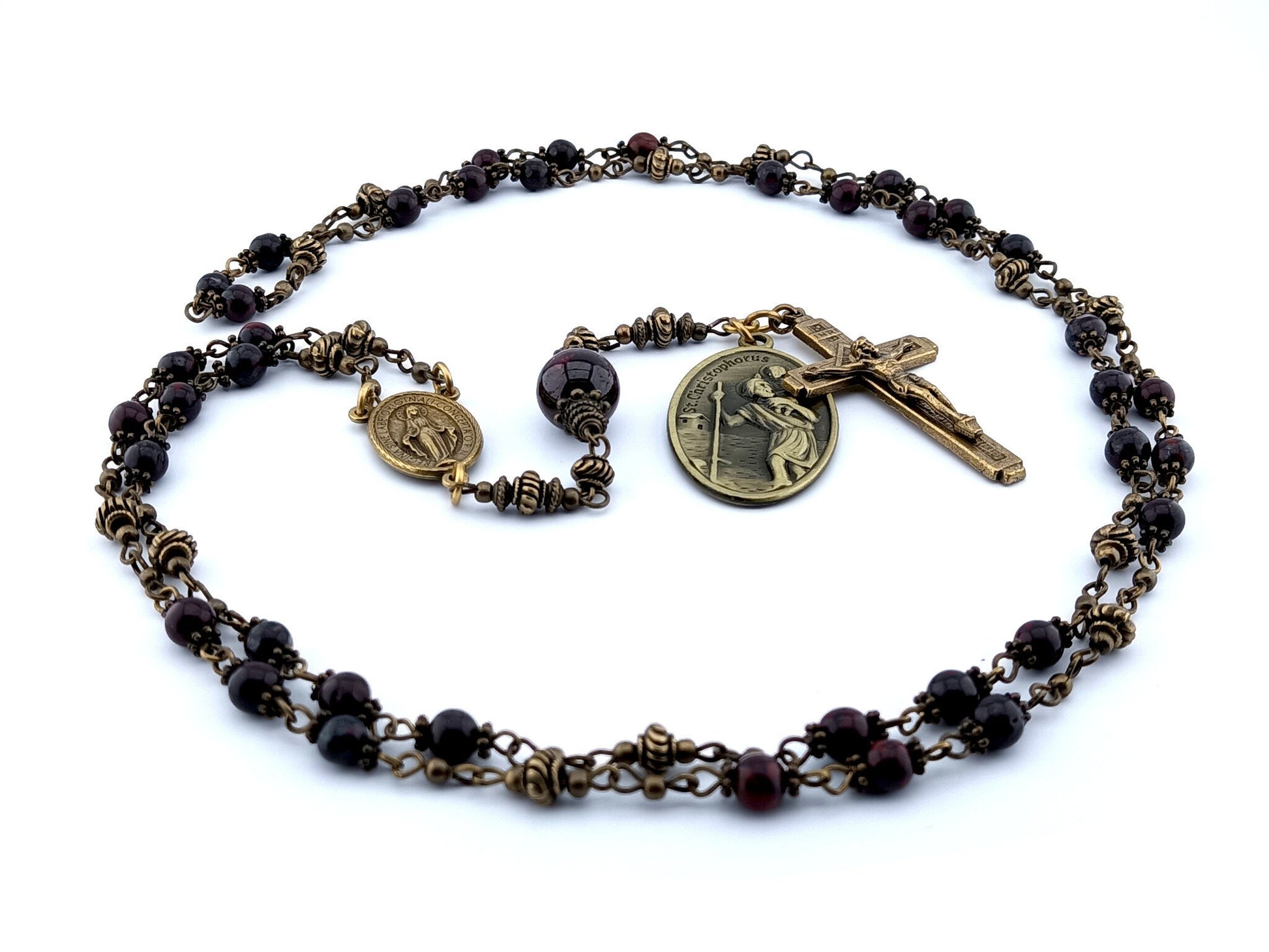 Saint Anthony unique rosary beads prayer chaplet with dark red gemstone beads, bronze crucifix, centre miraculous medal and Saint Christopher medal.