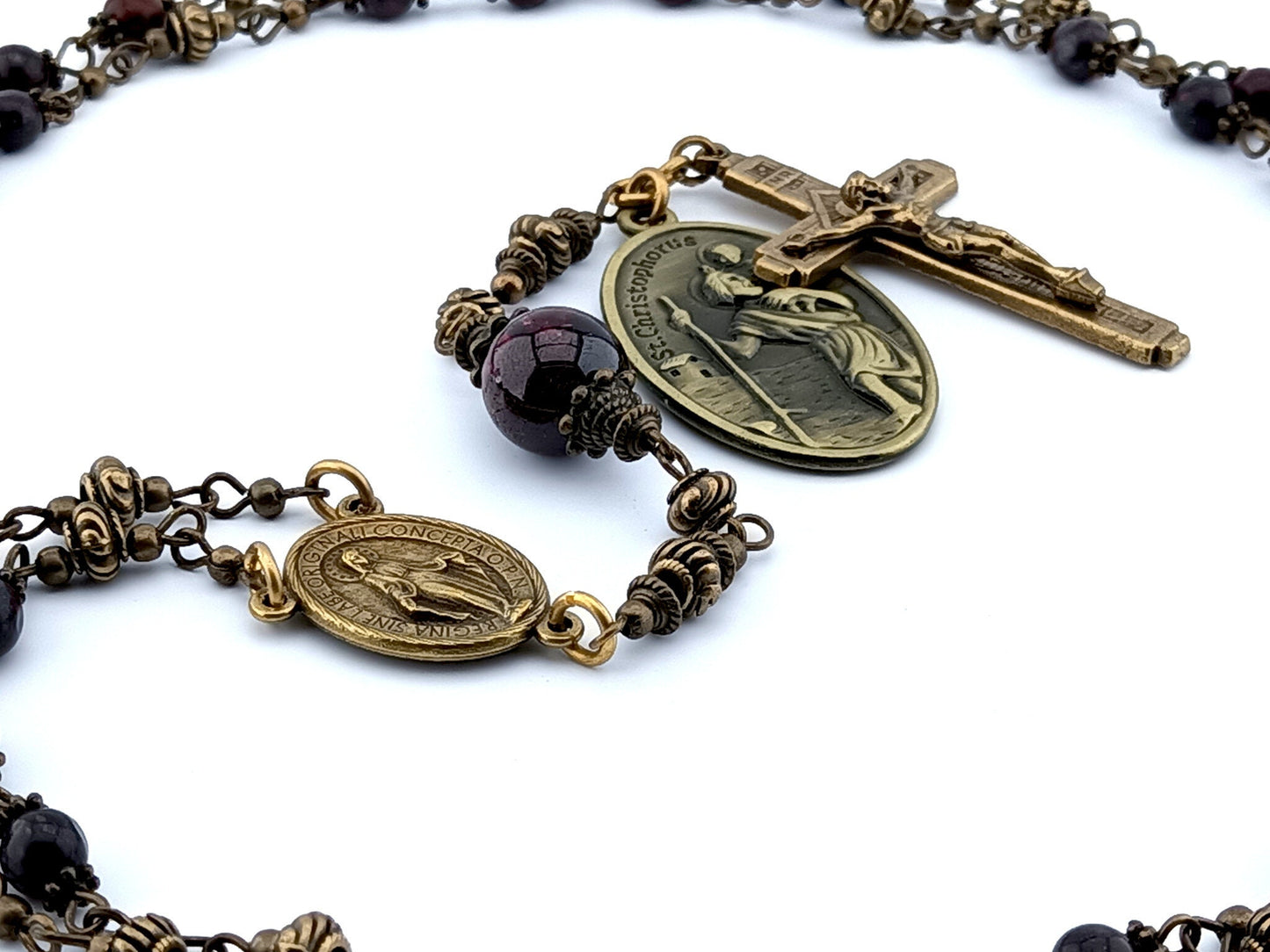 Saint Anthony unique rosary beads prayer chaplet with dark red gemstone beads, bronze crucifix, centre miraculous medal and Saint Christopher medal.