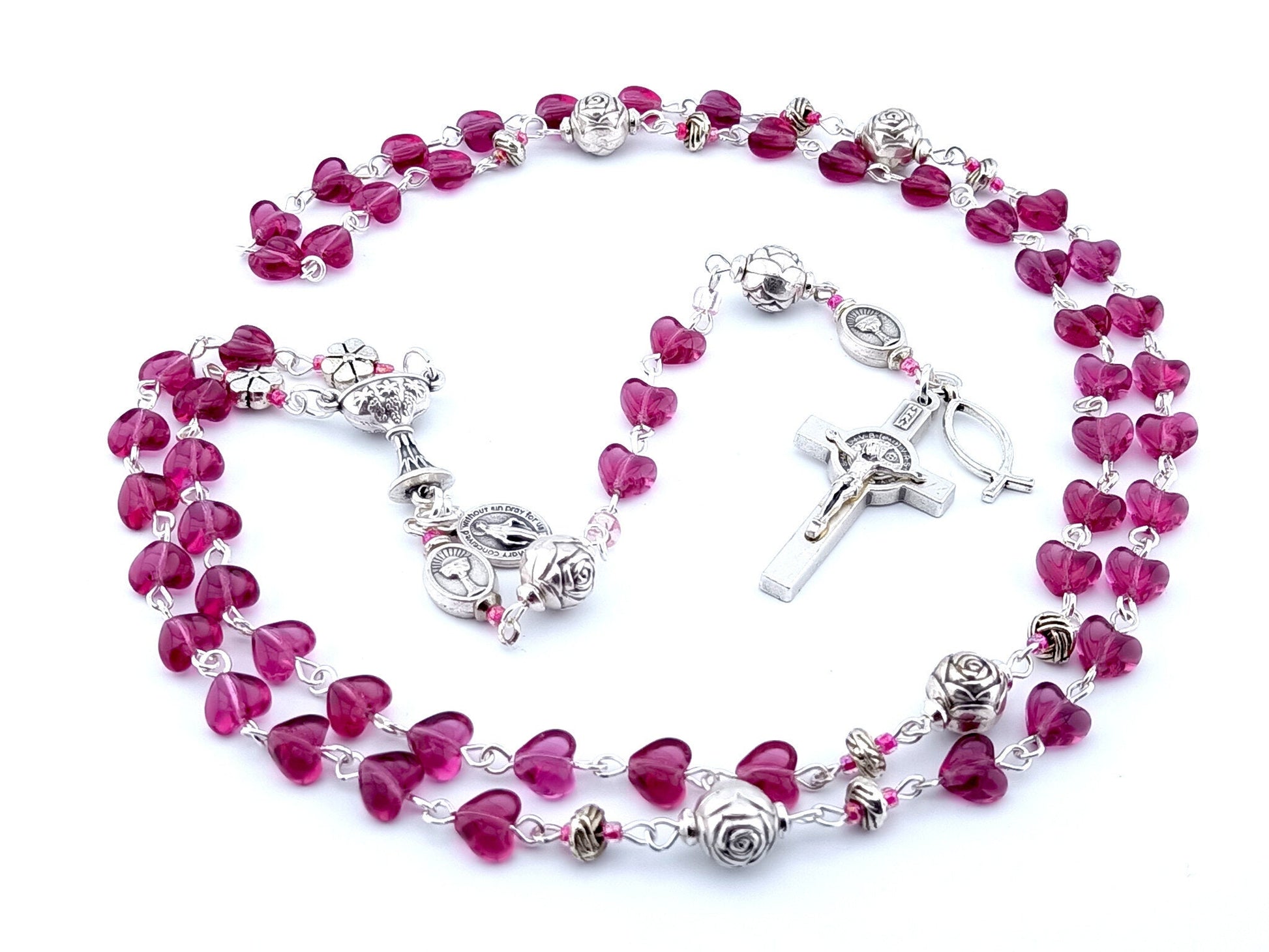 First Holy Communion unique rosary beads with purple heart glass beads, Saint benedict crucifix, silver rose pater beads and chalice centre medal.