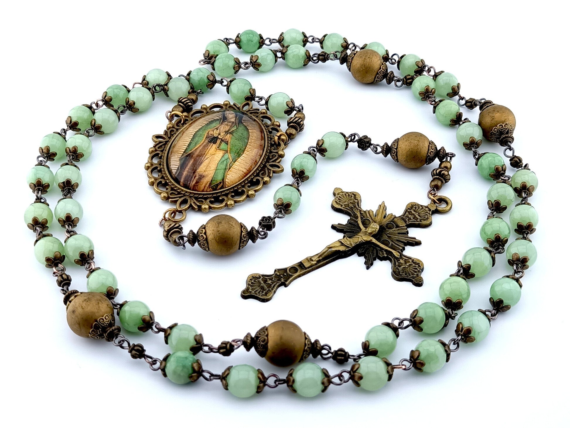 Our Lady of Guadalupe unique rosary beads with jade and gold glass beads, bronze crucifix and centre picture medal and bead caps.