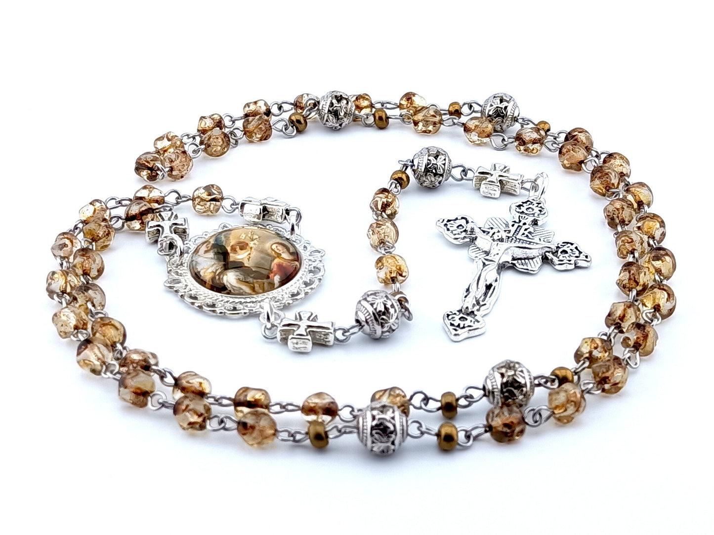 The Annunciation to Mary unique rosary beads with brown nugget glass beads, silver crucifix, picture centre medal, pater beads and linking cross beads.