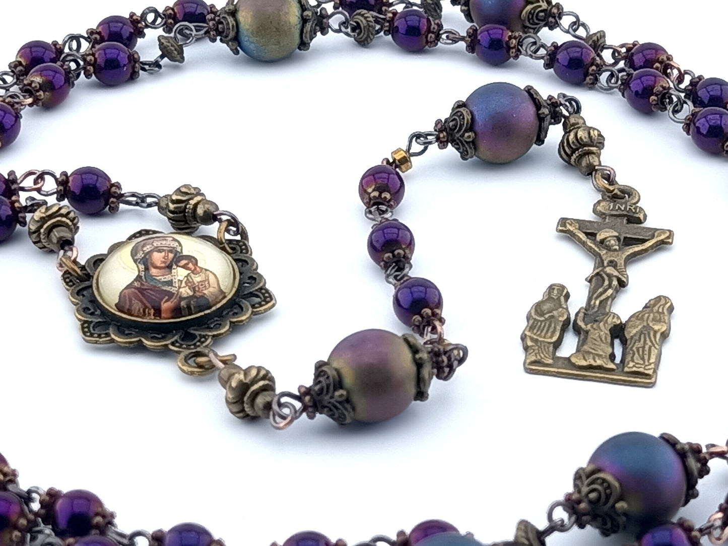 Our Lady of Perpetual Help unique rosary beads with purple hematite beads, bronze two Marys crucifix, picture centre medal and bead caps.