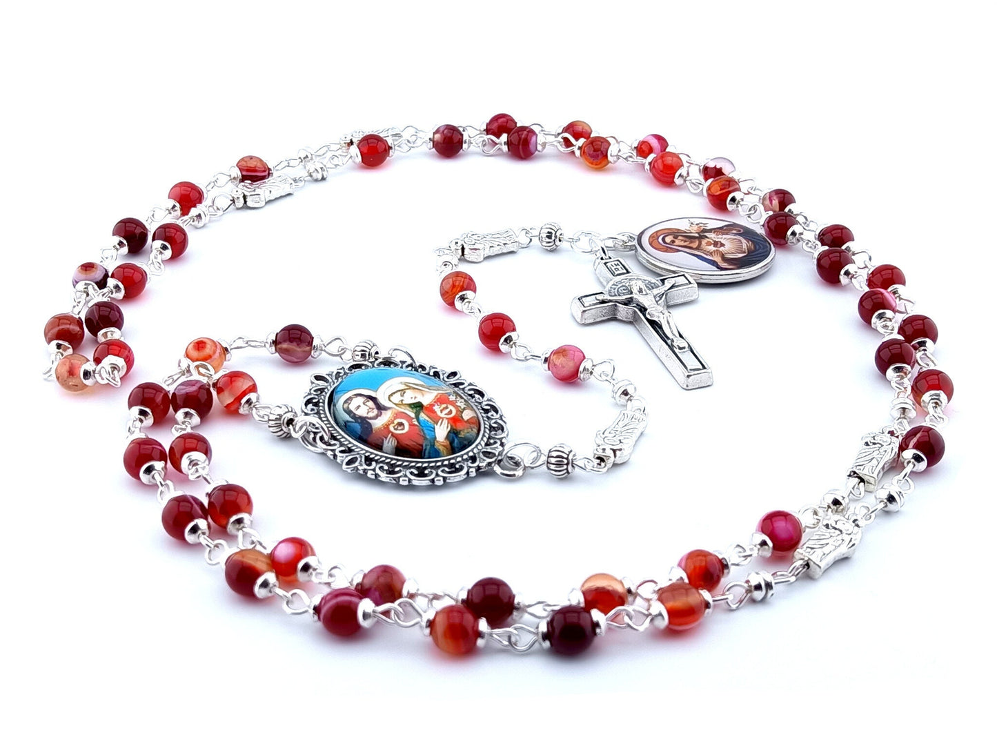 The two Hearts of Jesus and Mary unique rosary beads with red agate gemstone beads, silver Saint Benedict crucifix, picture centre medal and pater beads.