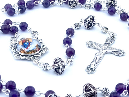 Our Lady Queen of Heaven unique rosary beads with purple amethyst gemstone beads, silver crucifix, picture centre medal, pater beads and linking beads.