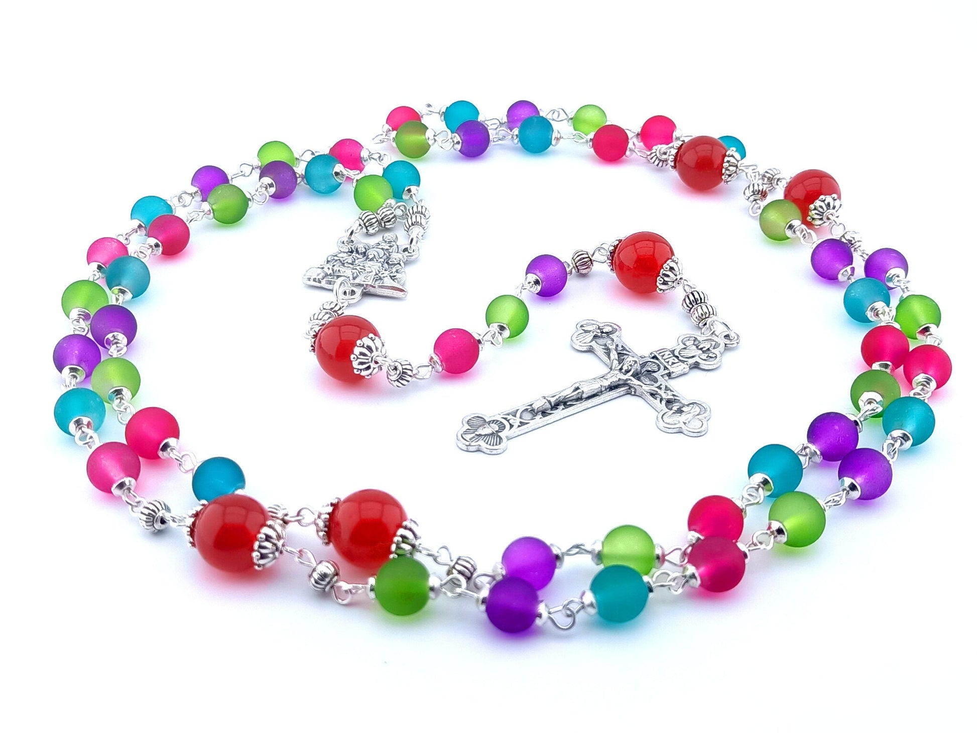 The Nativity unique rosary beads with multicoloured glass beads, silver Holy Spirit crucifix, Nativity centre medal and silver linking beads.