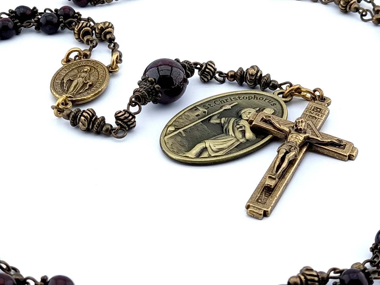 Saint Anthony unique rosary beads prayer chaplet with dark red gemstone beads, bronze crucifix, centre miraculous medal and Saint Christopher medal.