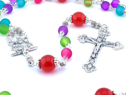 The Nativity unique rosary beads with multicoloured glass beads, silver Holy Spirit crucifix, Nativity centre medal and silver linking beads.