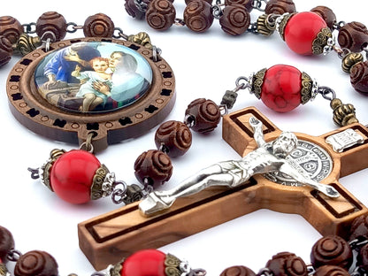 The Nativity unique rosary beads with carved wooden beads, Saint Benedict crucifix, picture centre medal and large red gemstone pater beads.
