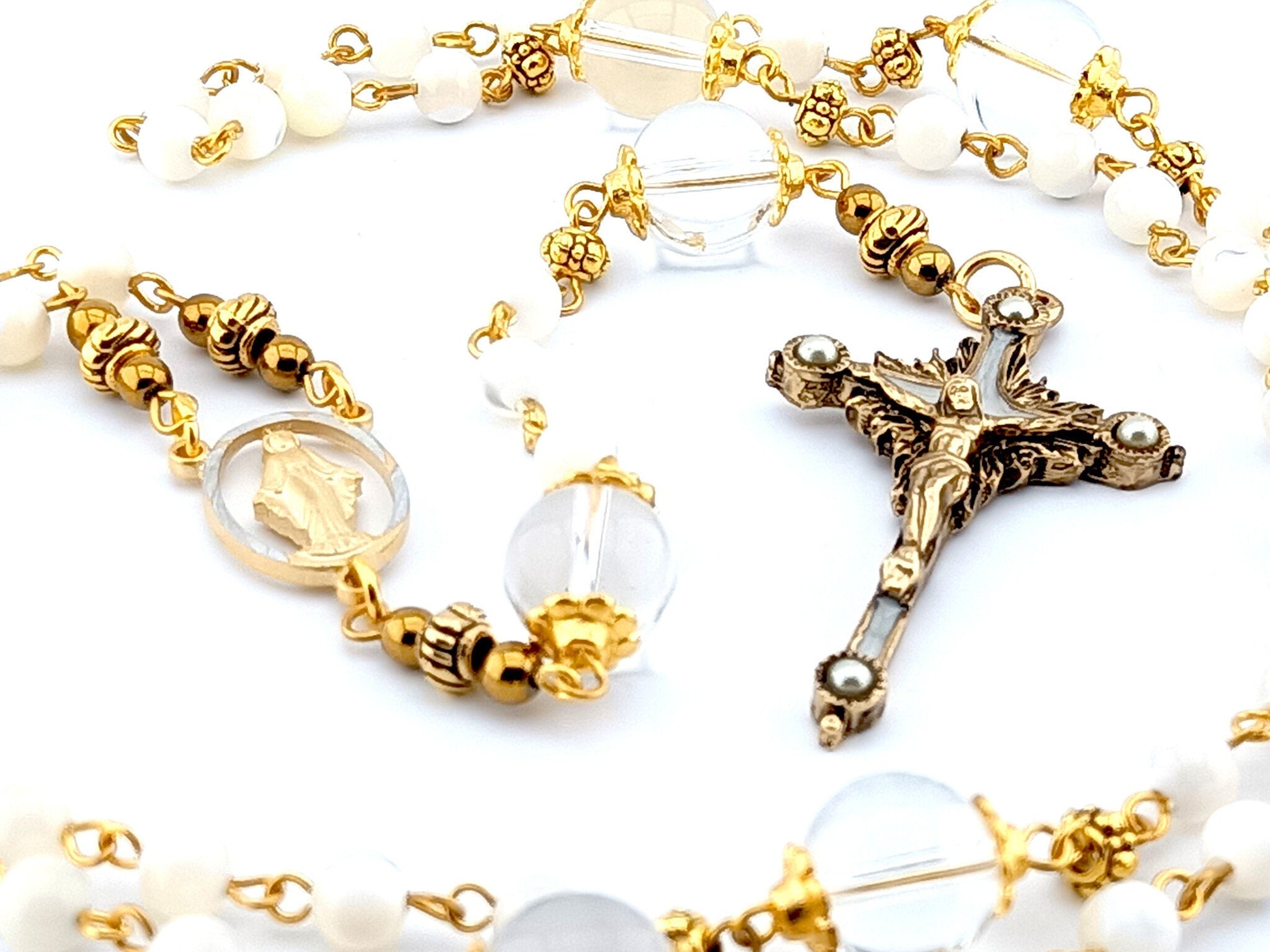 Miraculous Medal unique rosary beads with mother of pearl and glass beads, pewter crucifix and golden linking beads.