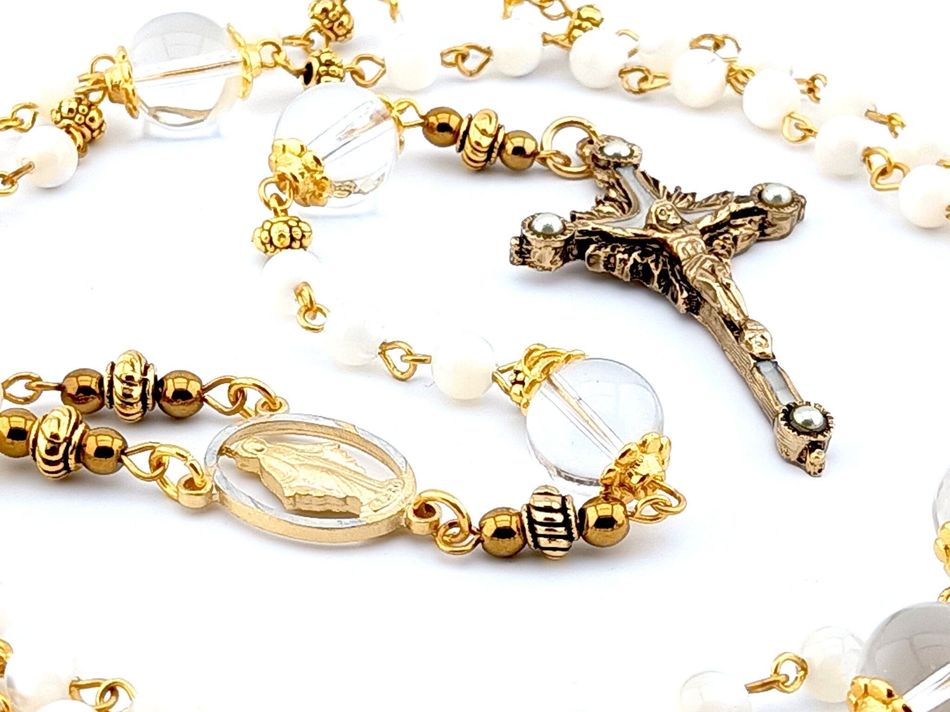 Miraculous Medal unique rosary beads with mother of pearl and glass beads, pewter crucifix and golden linking beads.