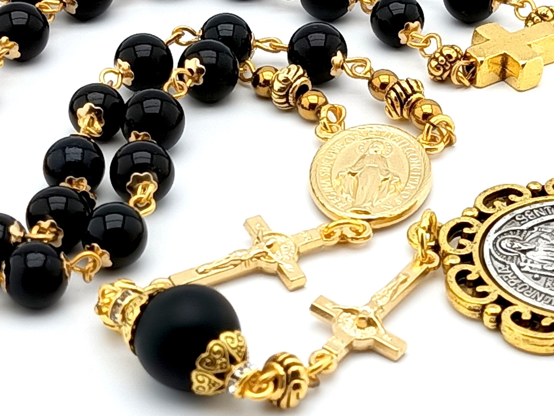 Saint Benedict unique rosary beads prayer chaplet with black and gold beads, medals and linking crucifixes.