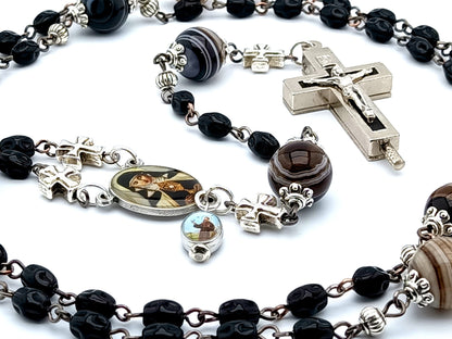 Saint Clare of Assisi unique rosary beads with black nugget glass beads, relic holder crucifix, picture centre medal and brown striped agate gemstone pater beads.