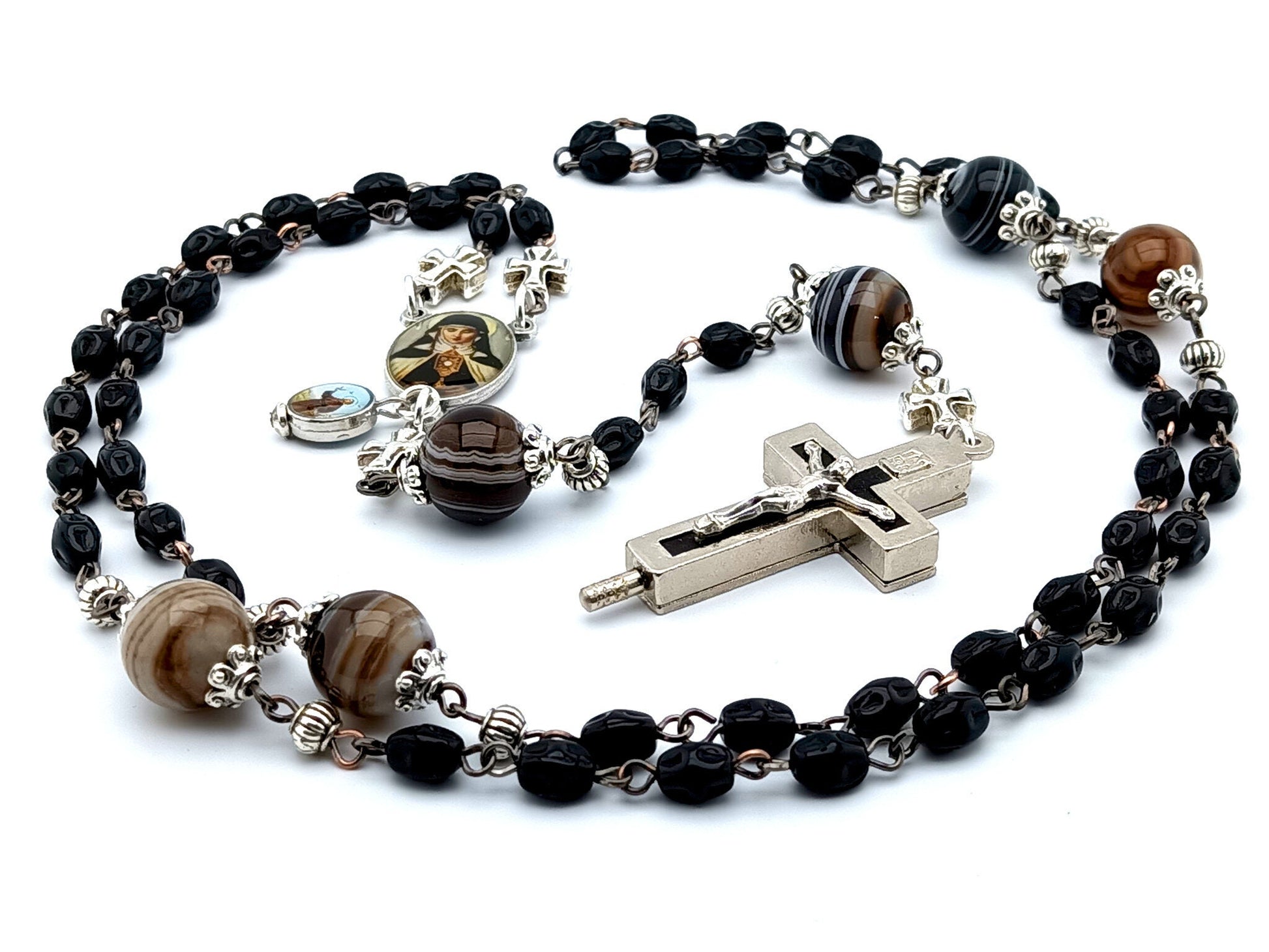 Saint Clare of Assisi unique rosary beads with black nugget glass beads, relic holder crucifix, picture centre medal and brown striped agate gemstone pater beads.