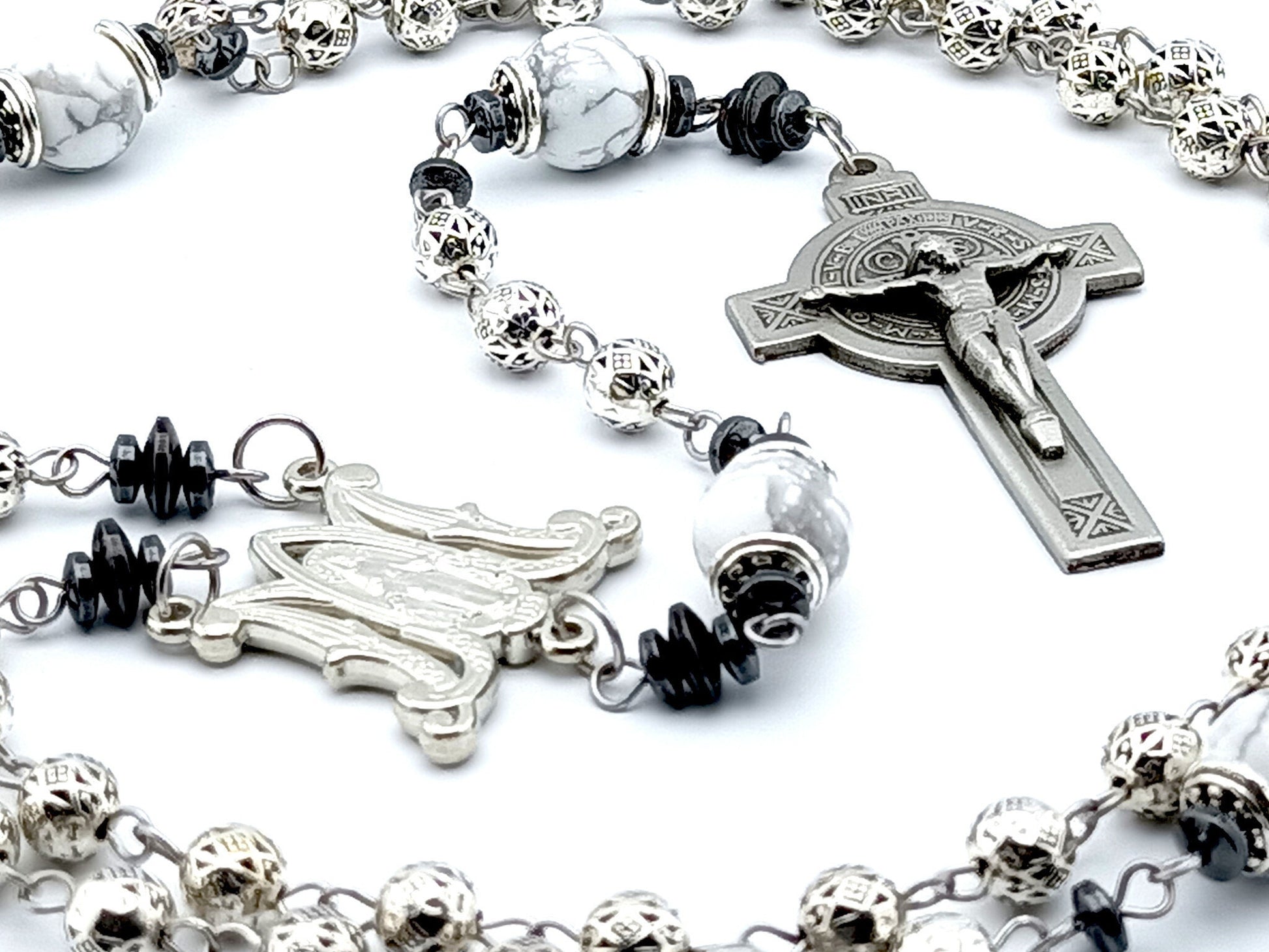 Saint Benedict unique rosary beads with silver metal beads, pewter Saint Benedict crucifix, silver miraculous medal centre and white gemstone pater beads.
