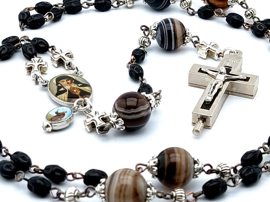 Saint Clare of Assisi unique rosary beads with black nugget glass beads, relic holder crucifix, picture centre medal and brown striped agate gemstone pater beads.