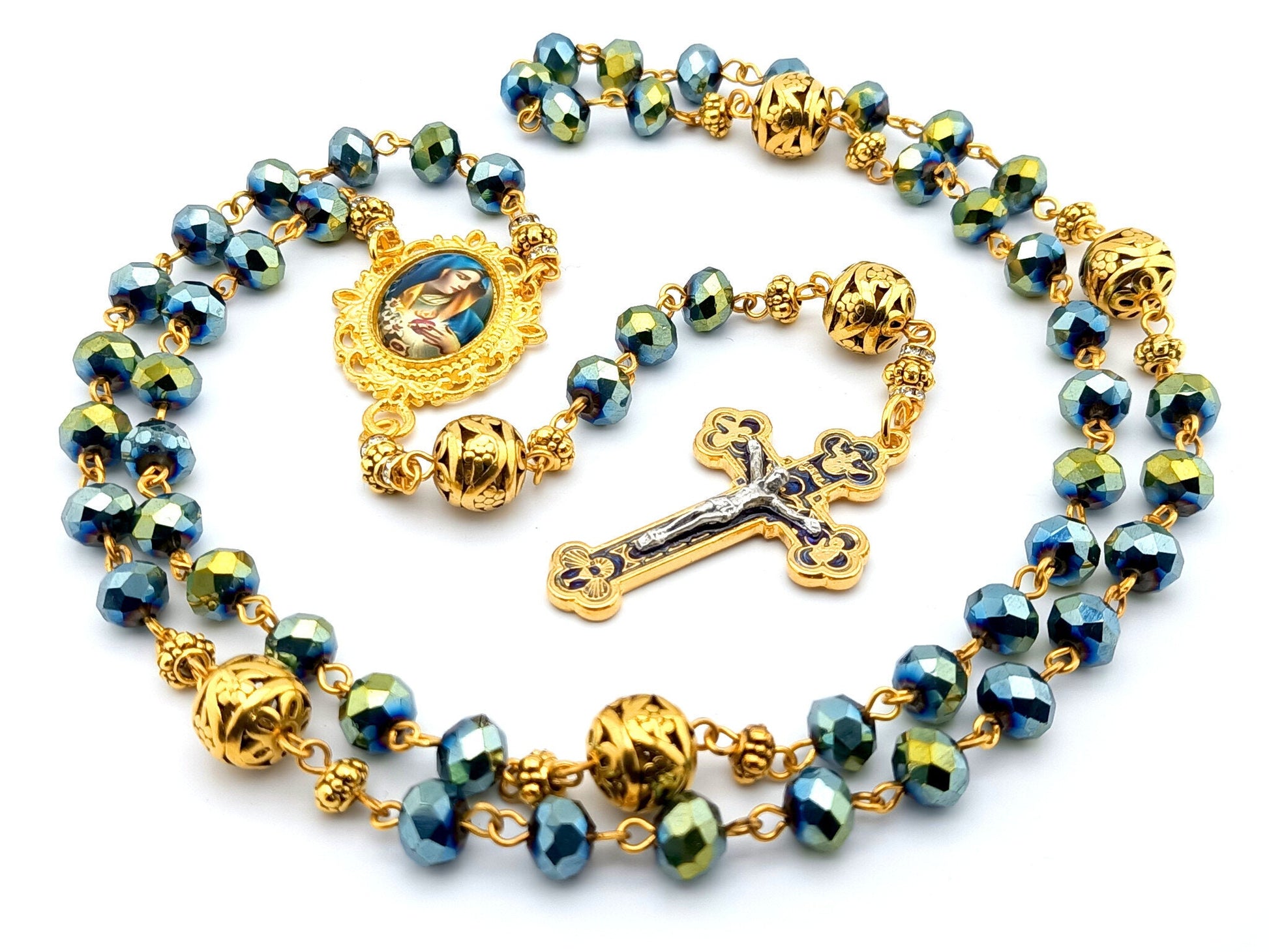 Our Lady of Sorrows unique rosary beads with faceted blue glass and golden beads, golden crucifix and picture centre medal.