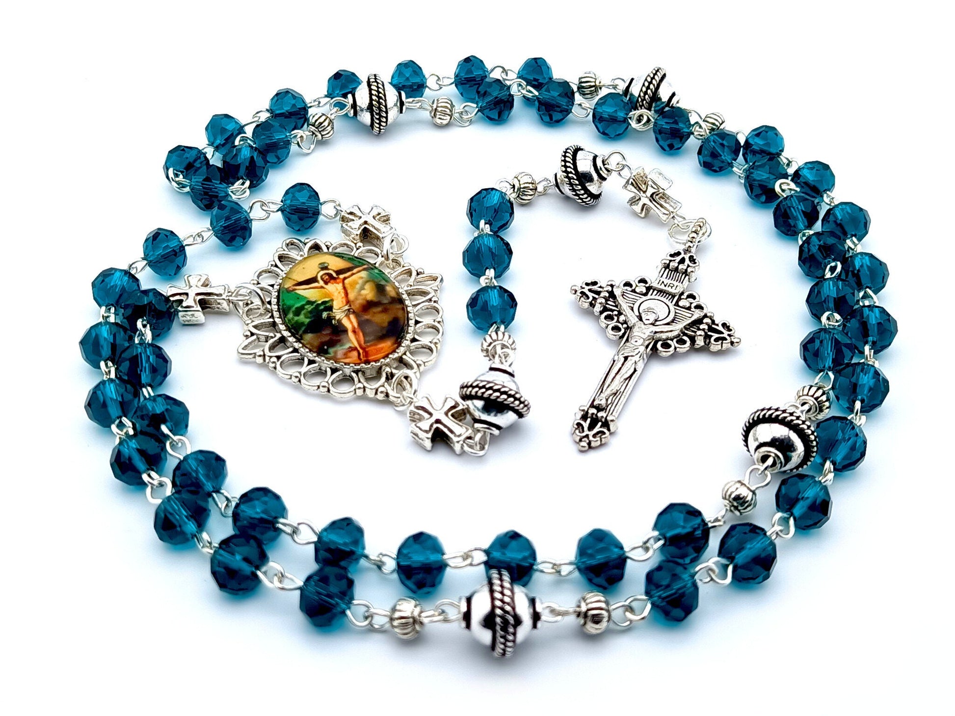 The Crucifixion unique rosary beads with blue faceted glass and silver beads, silver crucifix and picture centre medal.