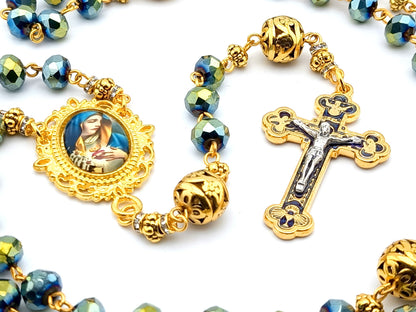 Our Lady of Sorrows unique rosary beads with faceted blue glass and golden beads, golden crucifix and picture centre medal.