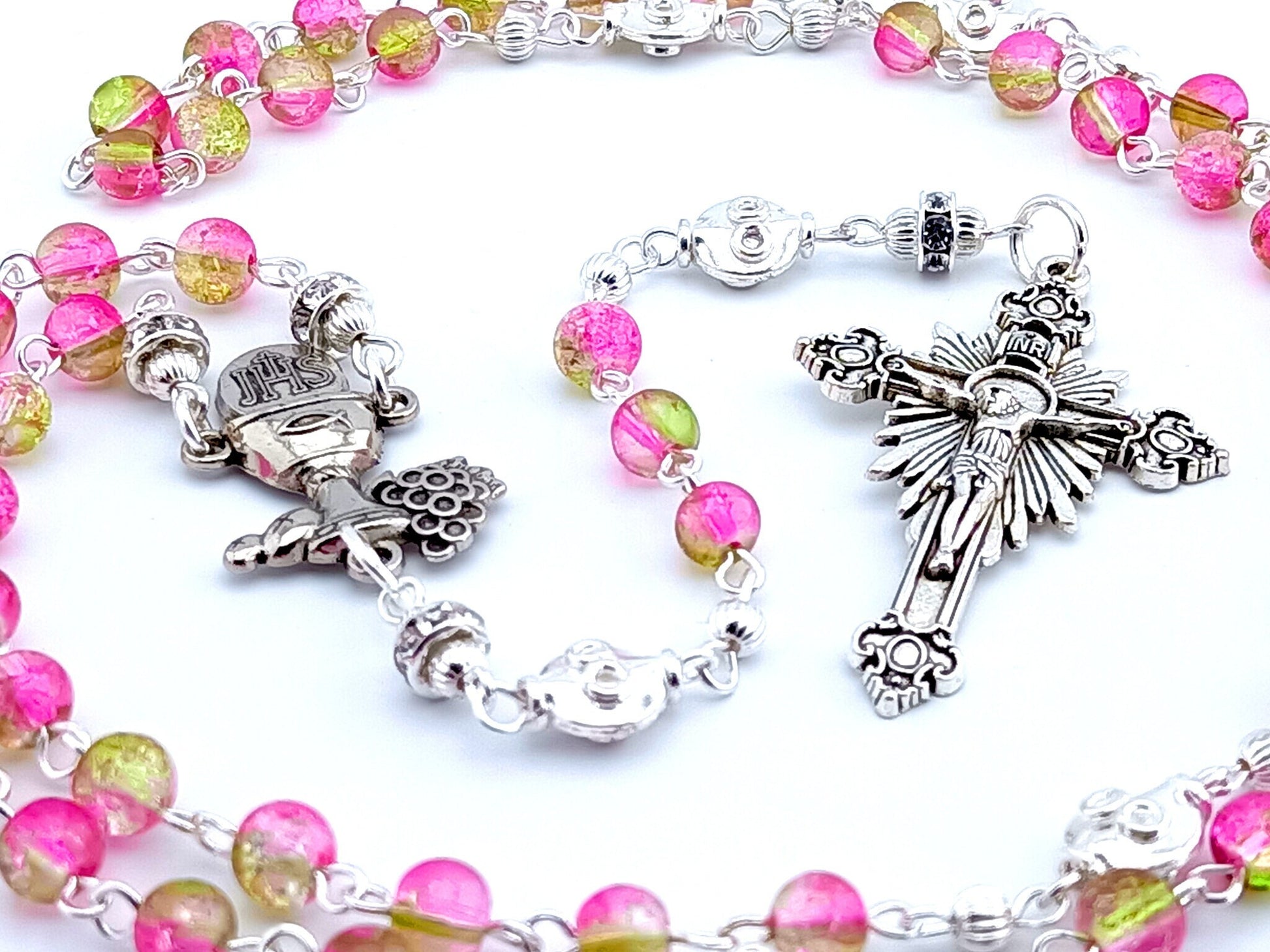 First Holy Communion unique rosary beads with pink and green glass beads, silver Eucharist centre medal and sunburst crucifix.