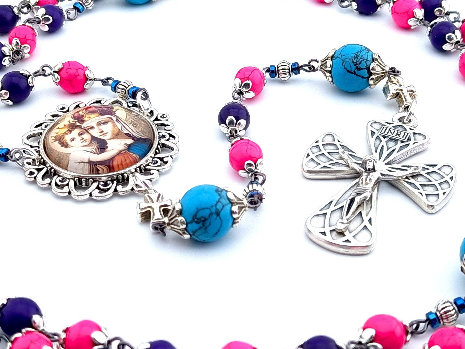 Our Lady Queen of Heaven unique rosary beads with multi coloured gemstone beads, turquoise gemstone pater beads, silver picture centre medal and harlequin crucifix.