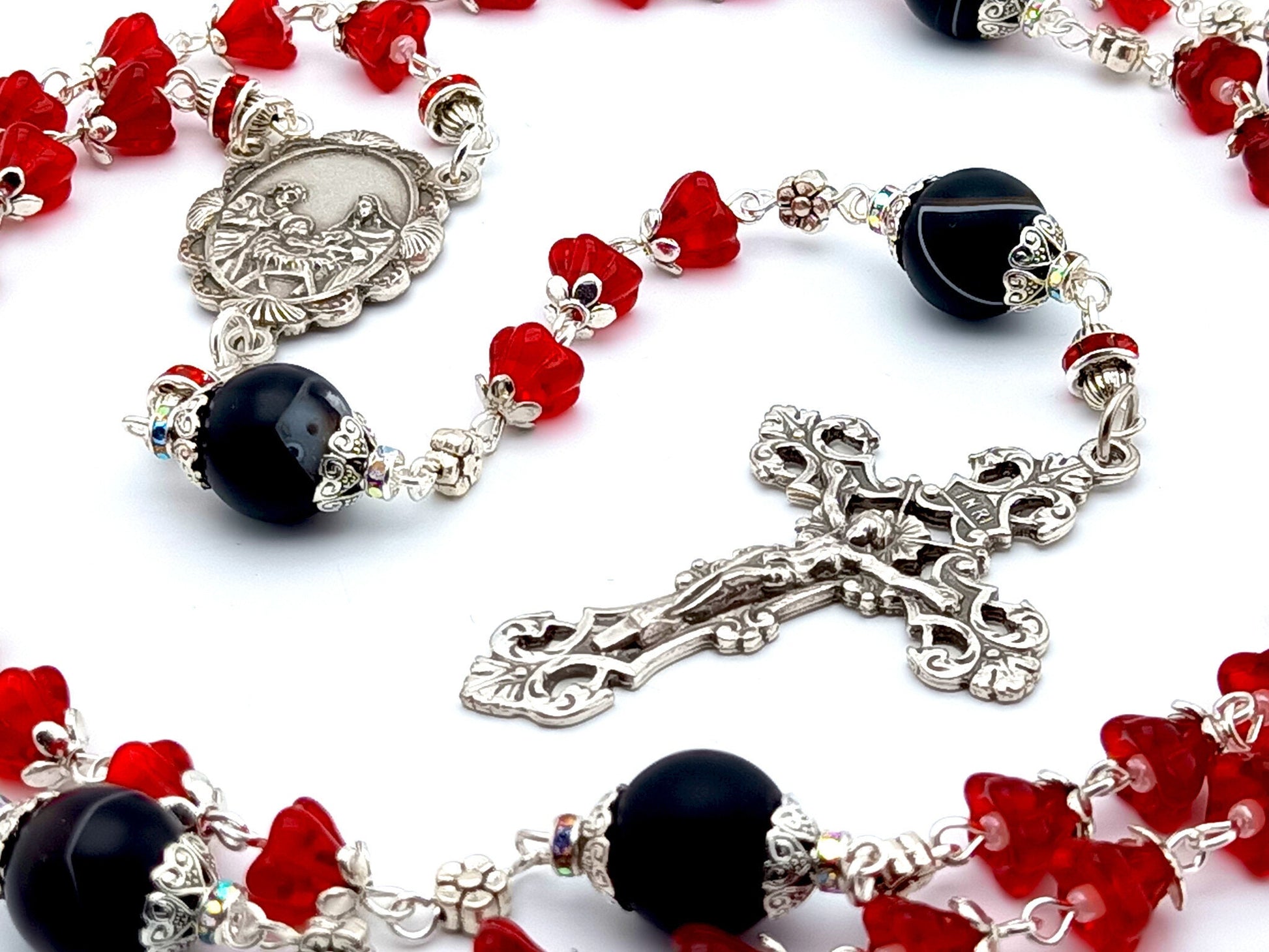 The Nativity unique rosary beads with red tulip glass and onyx beads, silver filigree crucifix and centre medal.