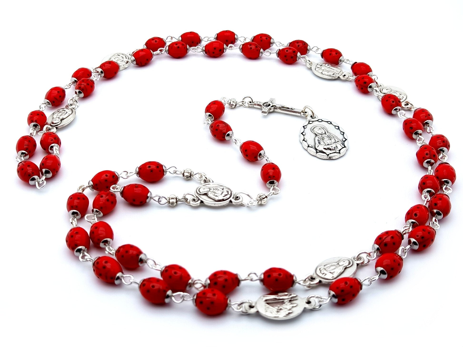 Our Lady of Sorrows unique rosary beads dolor rosary with red lady bug beads, silver Saint Benedict crucifix and medals.