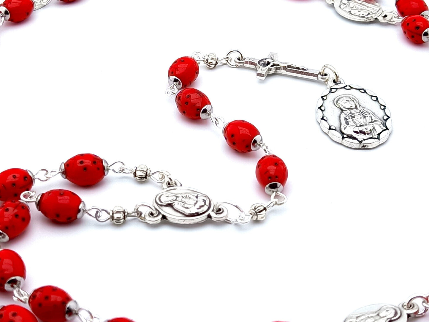 Our Lady of Sorrows unique rosary beads dolor rosary with red lady bug beads, silver Saint Benedict crucifix and medals.