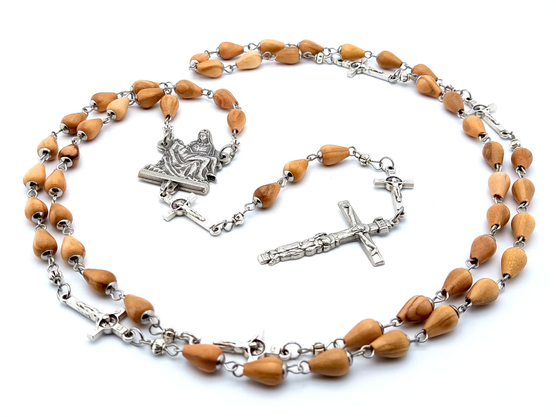 La Pieta unique rosary beads with wooden beads, silver linking crucifix pater beads, and centre medal.