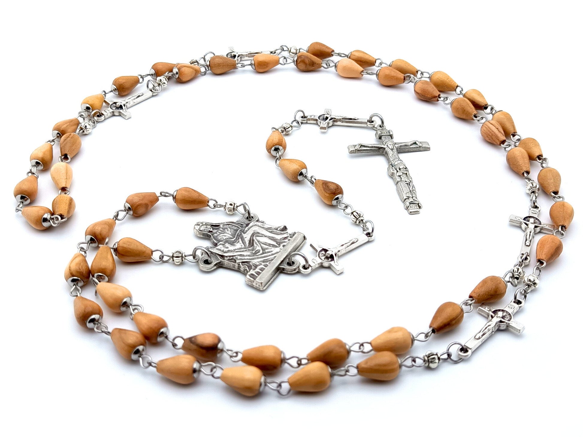 La Pieta unique rosary beads with wooden beads, silver linking crucifix pater beads, and centre medal.