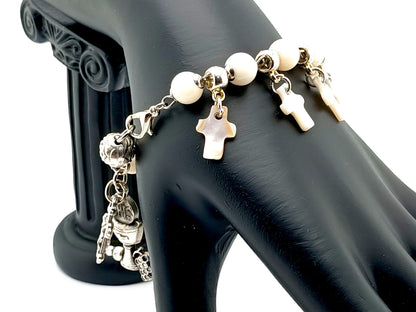 First Holy Communion unique rosary beads bracelet with mother of pearl beads and crosses, small crucifix and chalice medal.