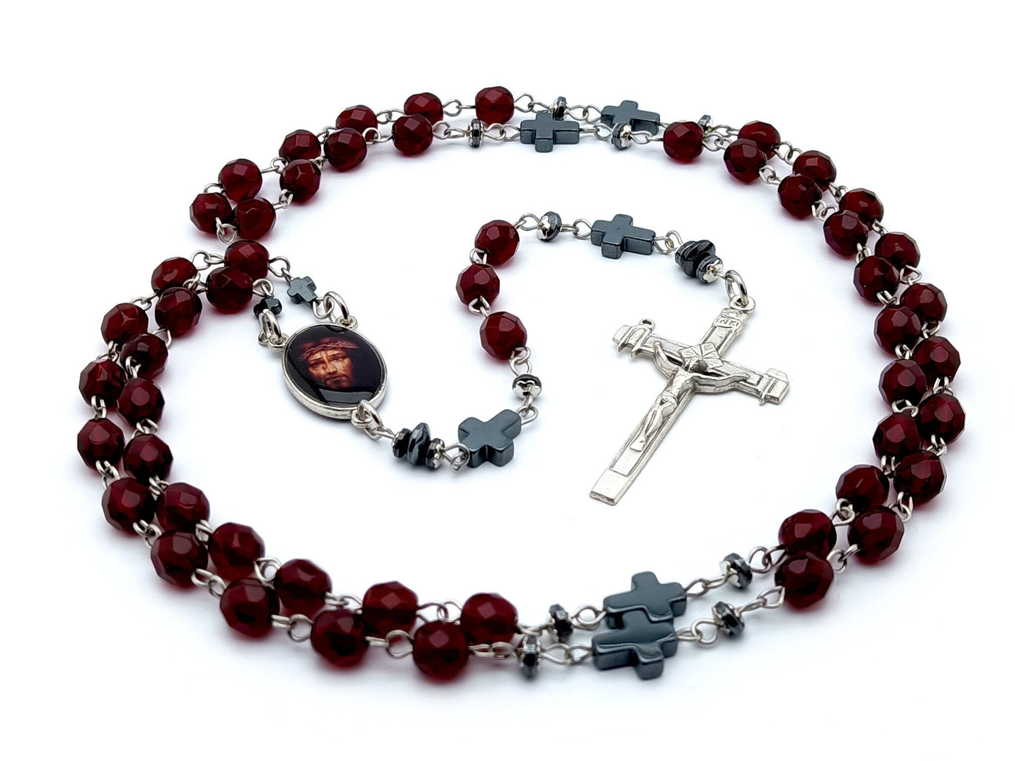 The Passion of Christ unique rosary beads with deep red glass faceted beads, hemitite pater beads, silver La Salette crucifix and picture centre medal.