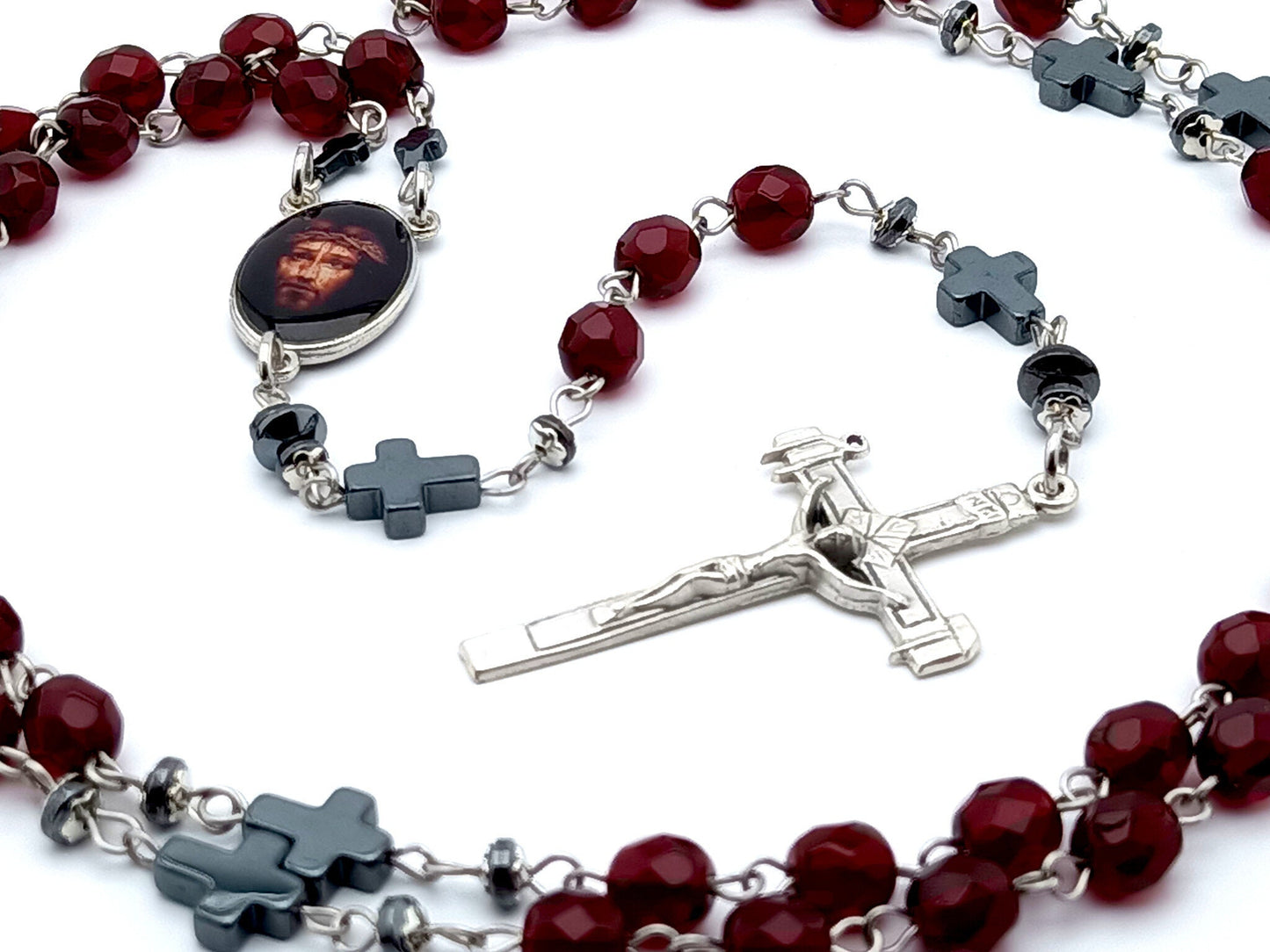 The Passion of Christ unique rosary beads with deep red glass faceted beads, hemitite pater beads, silver La Salette crucifix and picture centre medal.