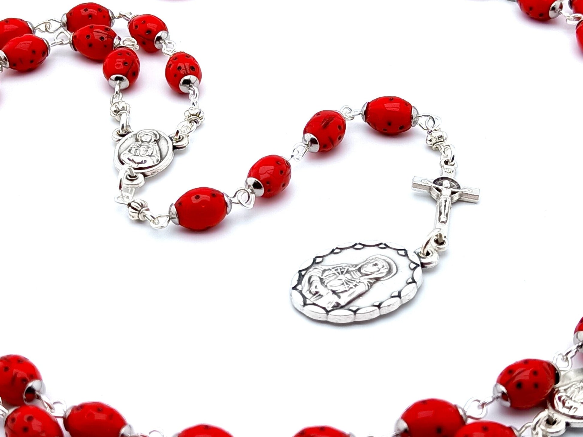 Our Lady of Sorrows unique rosary beads dolor rosary with red lady bug beads, silver Saint Benedict crucifix and medals.