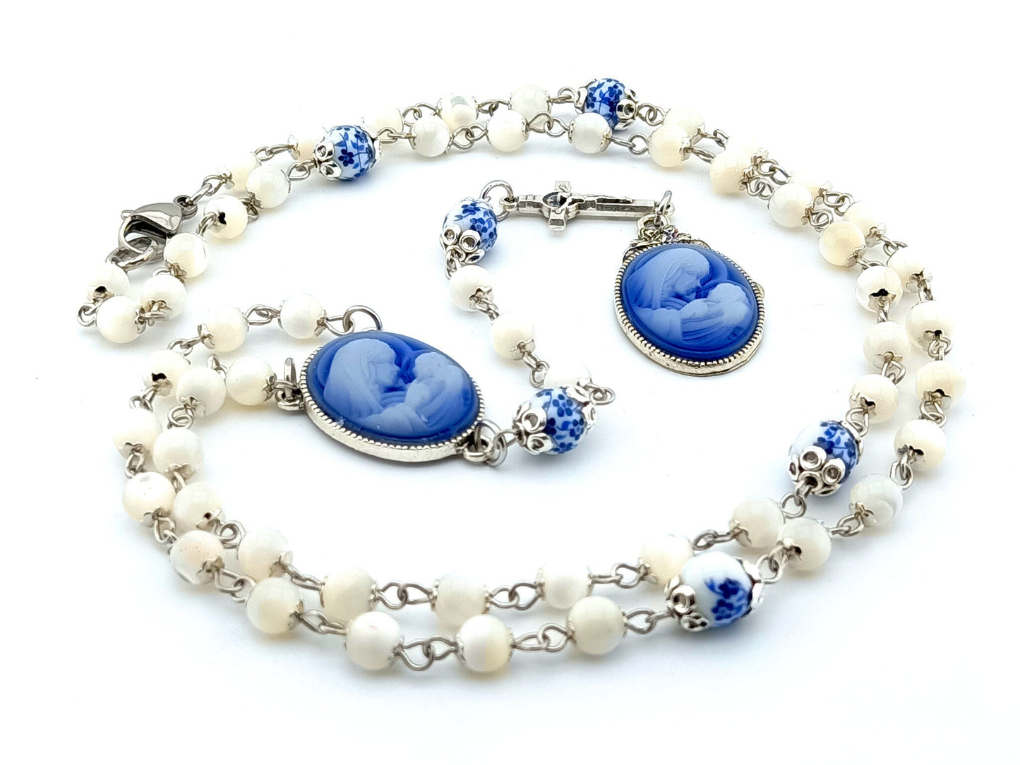 Virgin Mary and Child unique rosary beads with mother of pearl and porcelain beads, silver small linking crucifix, blue and white cameo centre medal and end medal.