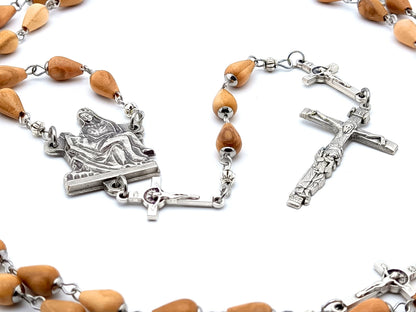 La Pieta unique rosary beads with wooden beads, silver linking crucifix pater beads, and centre medal.