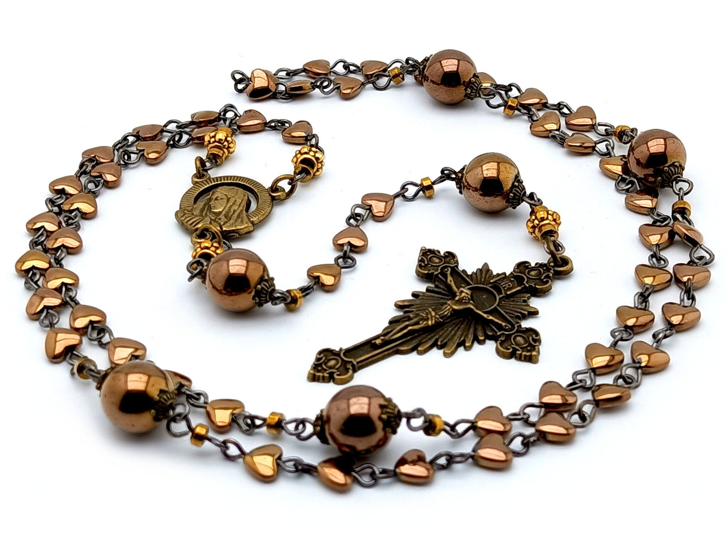 Our Lady of Sorrows unique rosary beads with bronze hematite beads, bronze sunburst crucifix and small centre medal.