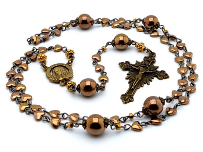Our Lady of Sorrows unique rosary beads with bronze hematite beads, bronze sunburst crucifix and small centre medal.