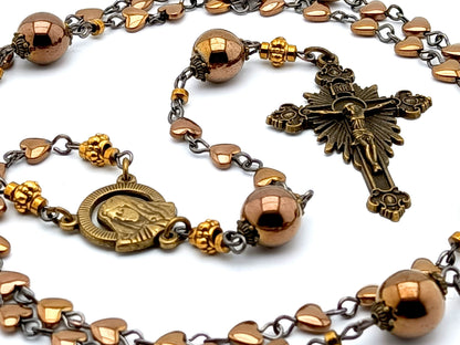 Our Lady of Sorrows unique rosary beads with bronze hematite beads, bronze sunburst crucifix and small centre medal.
