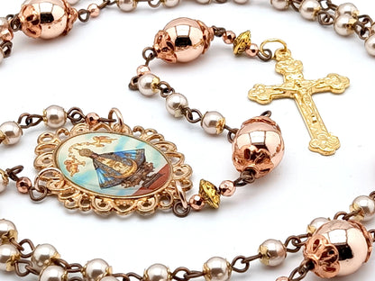 Our Lady of Charity unique rosary beads with rose gold hematite beads, golden Holy Trinity crucifix and picture centre medal.