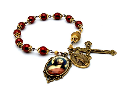 Crown of Thorns unique rosary beads single decade rosary with red hematite beads golden accessories, bronze crucifix, miraculous medal and picture centre medal.
