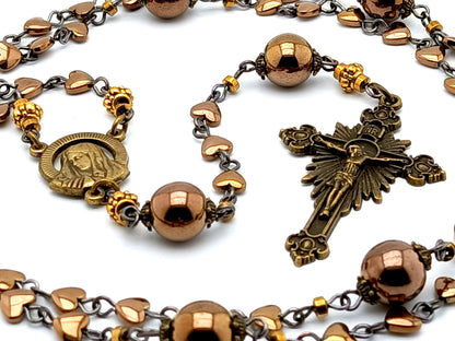 Our Lady of Sorrows unique rosary beads with bronze hematite beads, bronze sunburst crucifix and small centre medal.