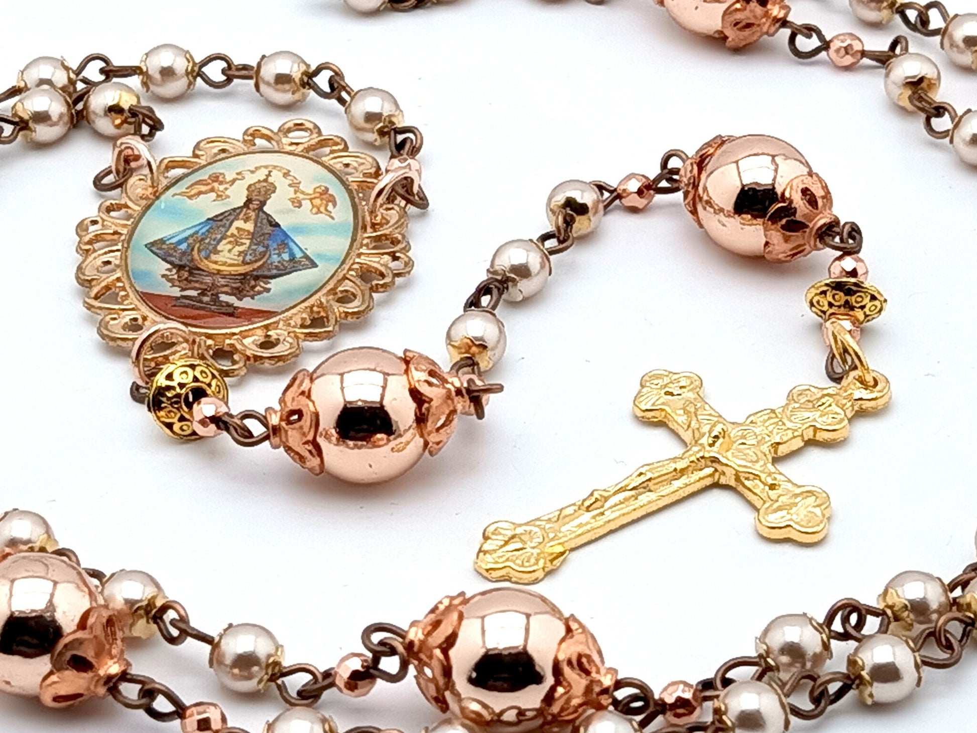 Our Lady of Charity unique rosary beads with rose gold hematite beads, golden Holy Trinity crucifix and picture centre medal.