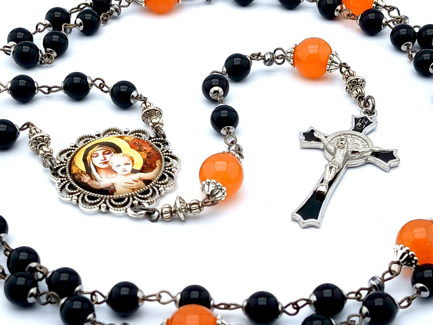 Our Lady of Laus unique rosary beads with black onyx gemstone and tangerine glass beads, black enamel crucifix and silver picture centre medal.