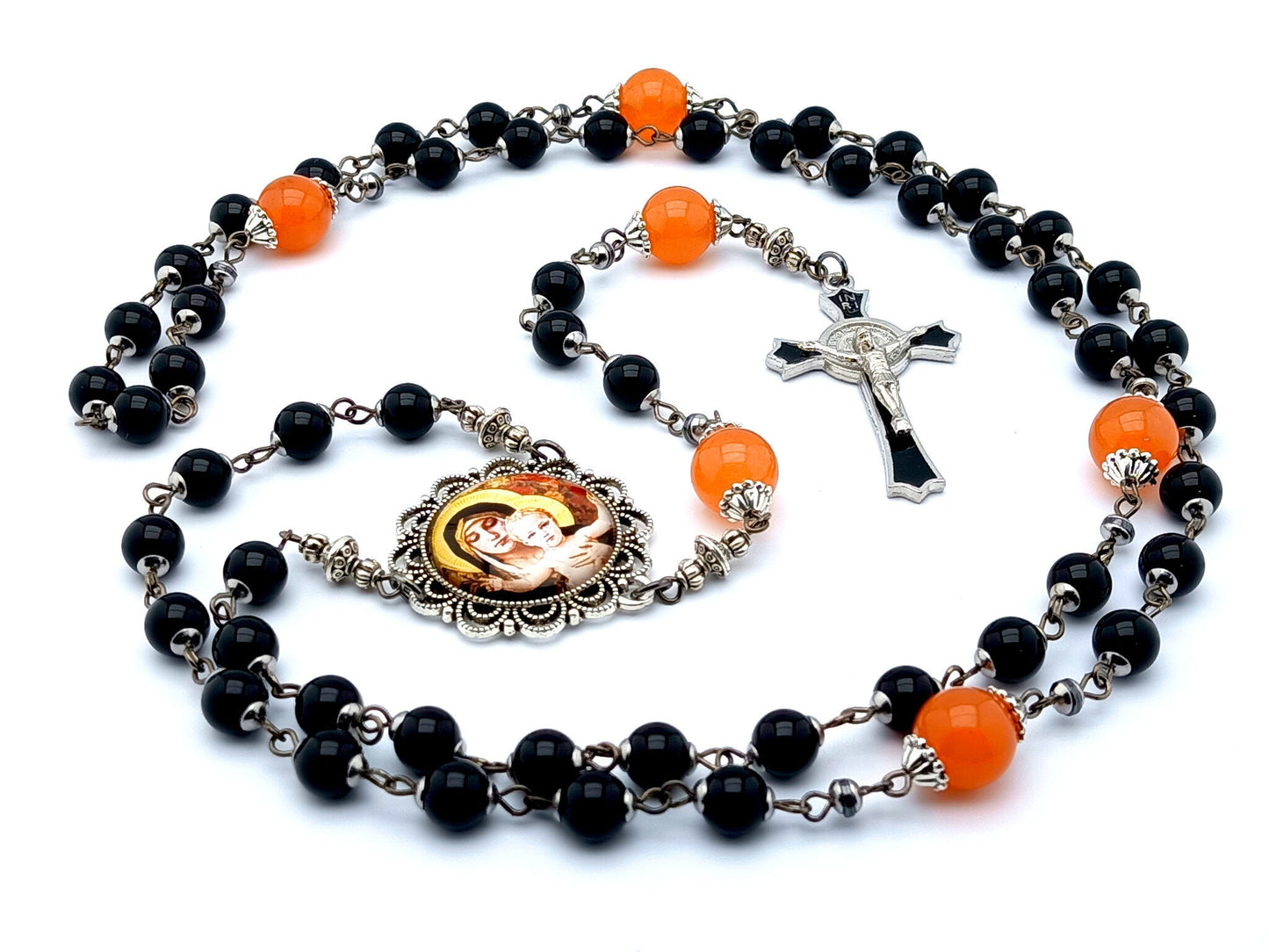 Our Lady of Laus unique rosary beads with black onyx gemstone and tangerine glass beads, black enamel crucifix and silver picture centre medal.